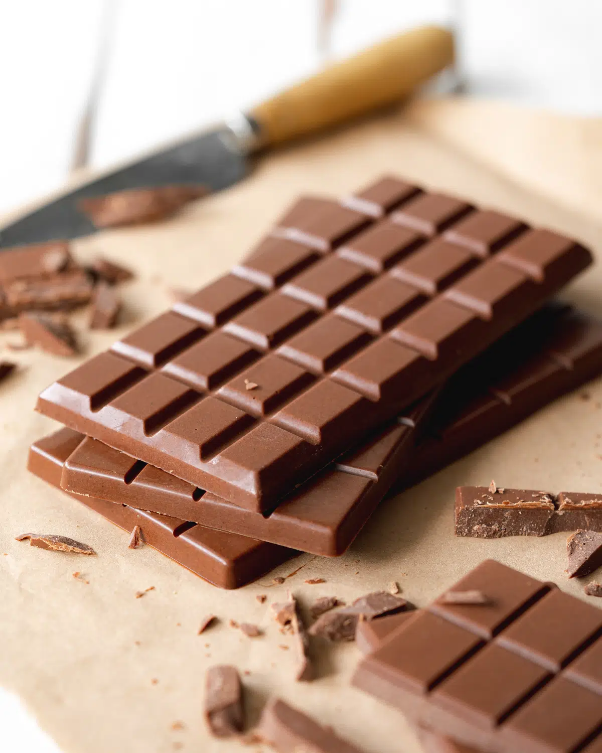 bars of dairy free chocolate on brown paper.