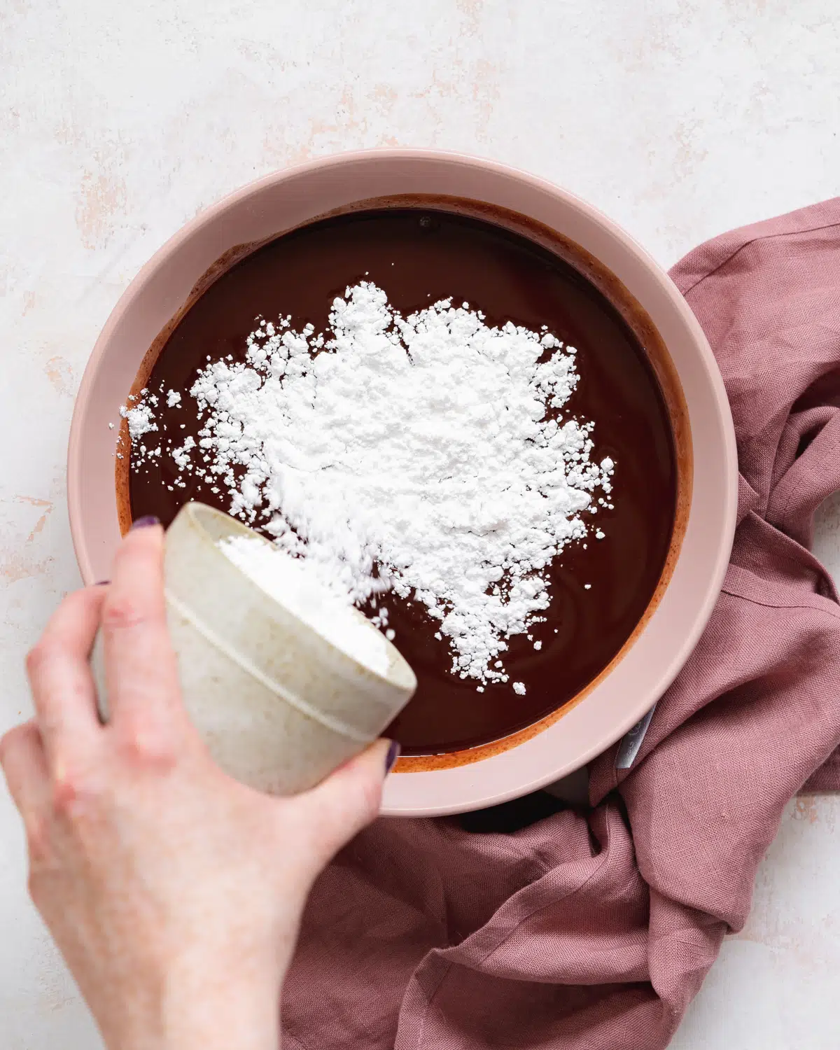 mixing ingredients to make dairy free chocolate.