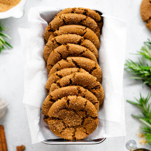 molasses cookies in loaf pan on light grey surface.