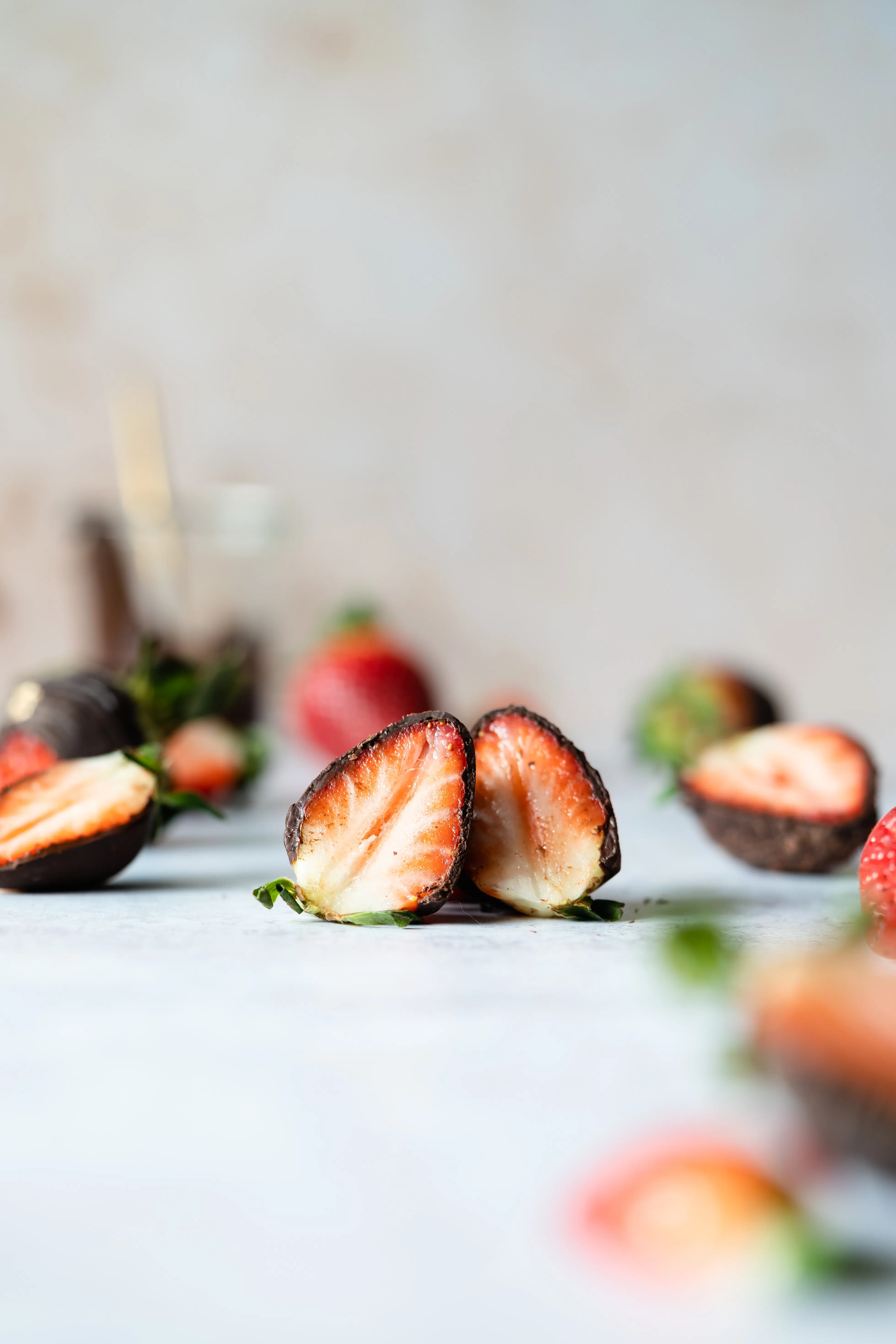 strawberries dipped in chocolate and sliced in half.