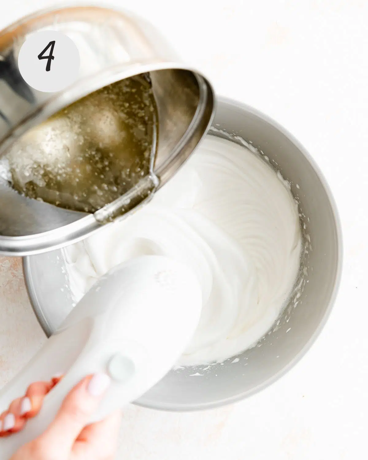 adding syrup to aquafaba.