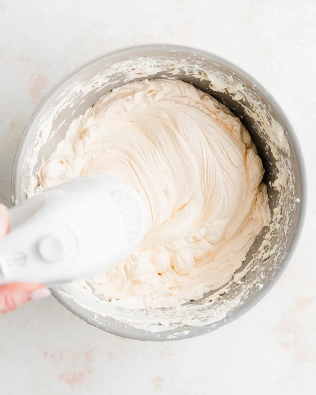 making vegan champagne frosting.