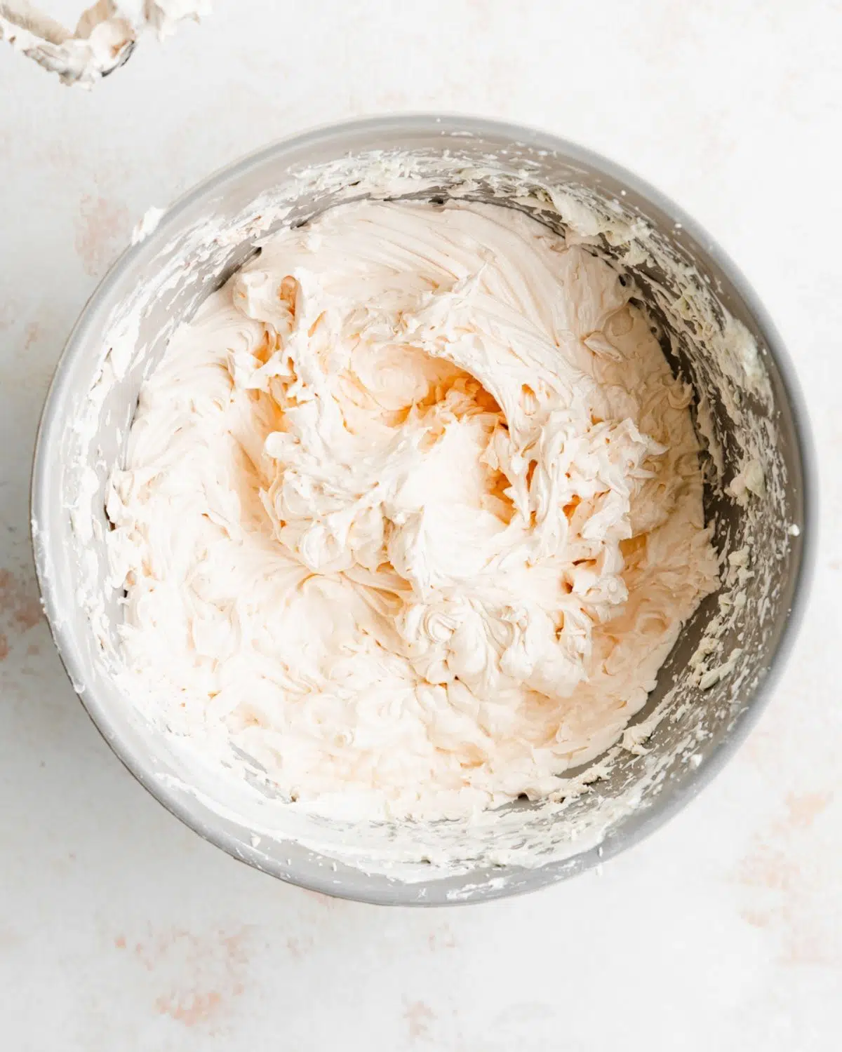 eggless italian meringue champagne buttercream in a bowl.