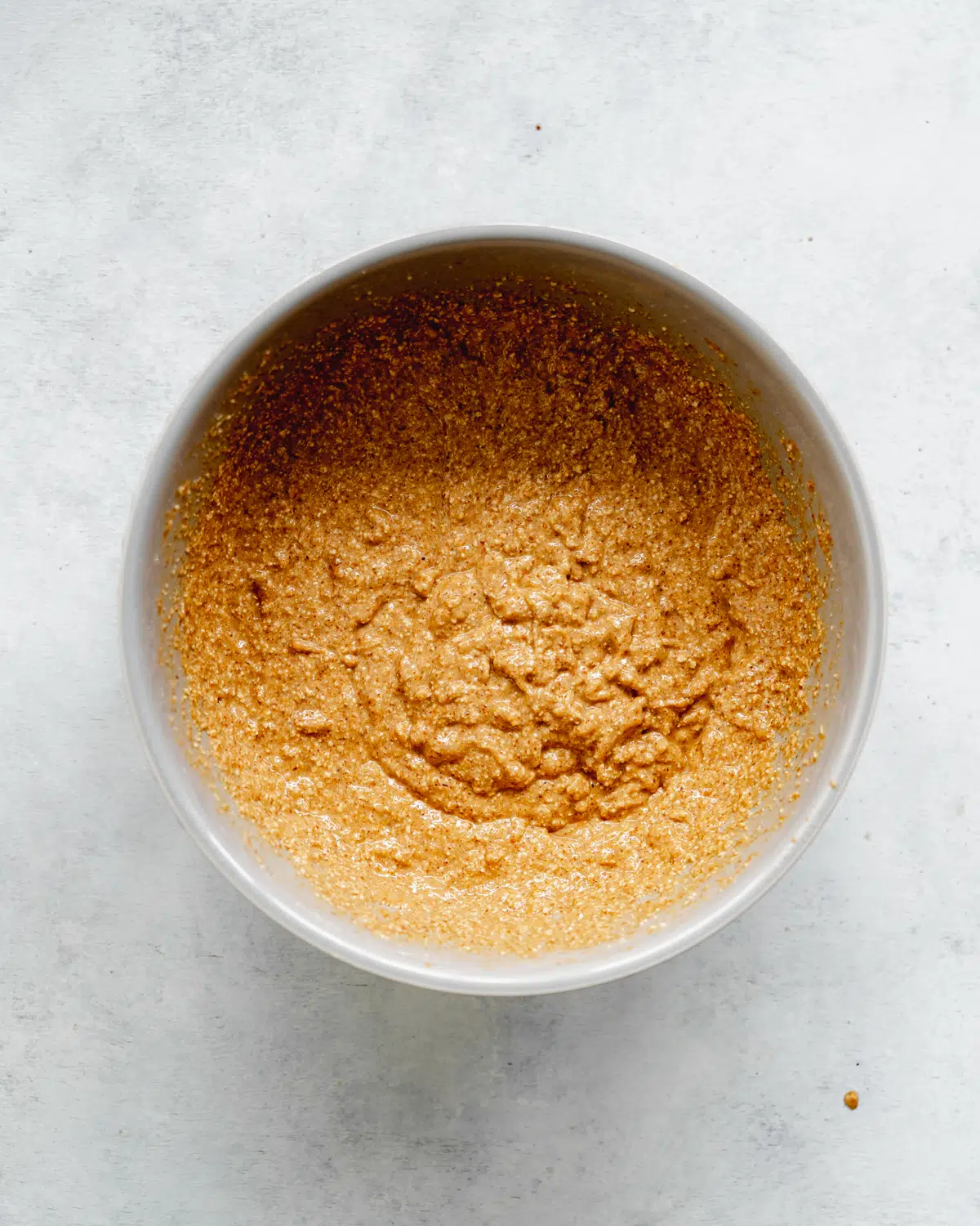 batter for vegan banana muffins in a bowl.