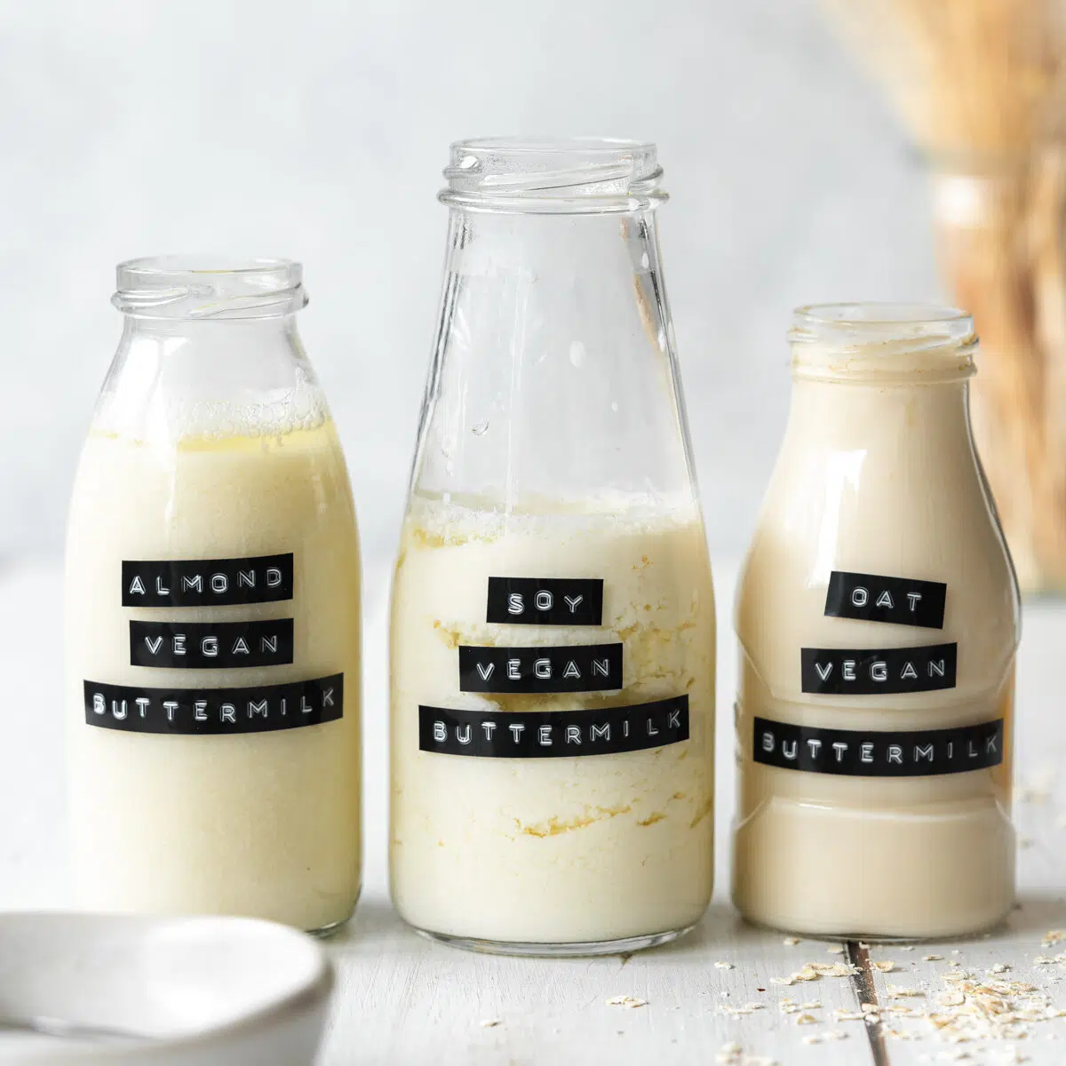 3 glass bottles of vegan buttermilk.