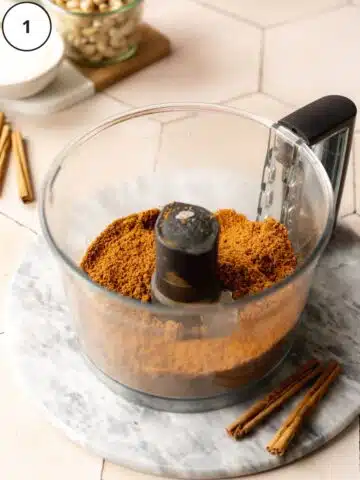 Blitzed biscoff cookies, cinnamon, and salt in the base of a food processor.