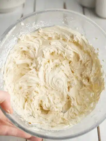 whipped vanilla filling for homemade oreos in a glass bowl.