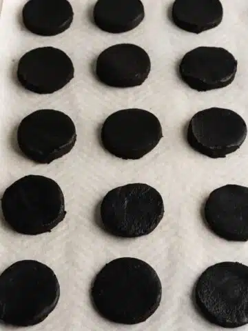 oreo cookies on a lined cookie sheet before baking.